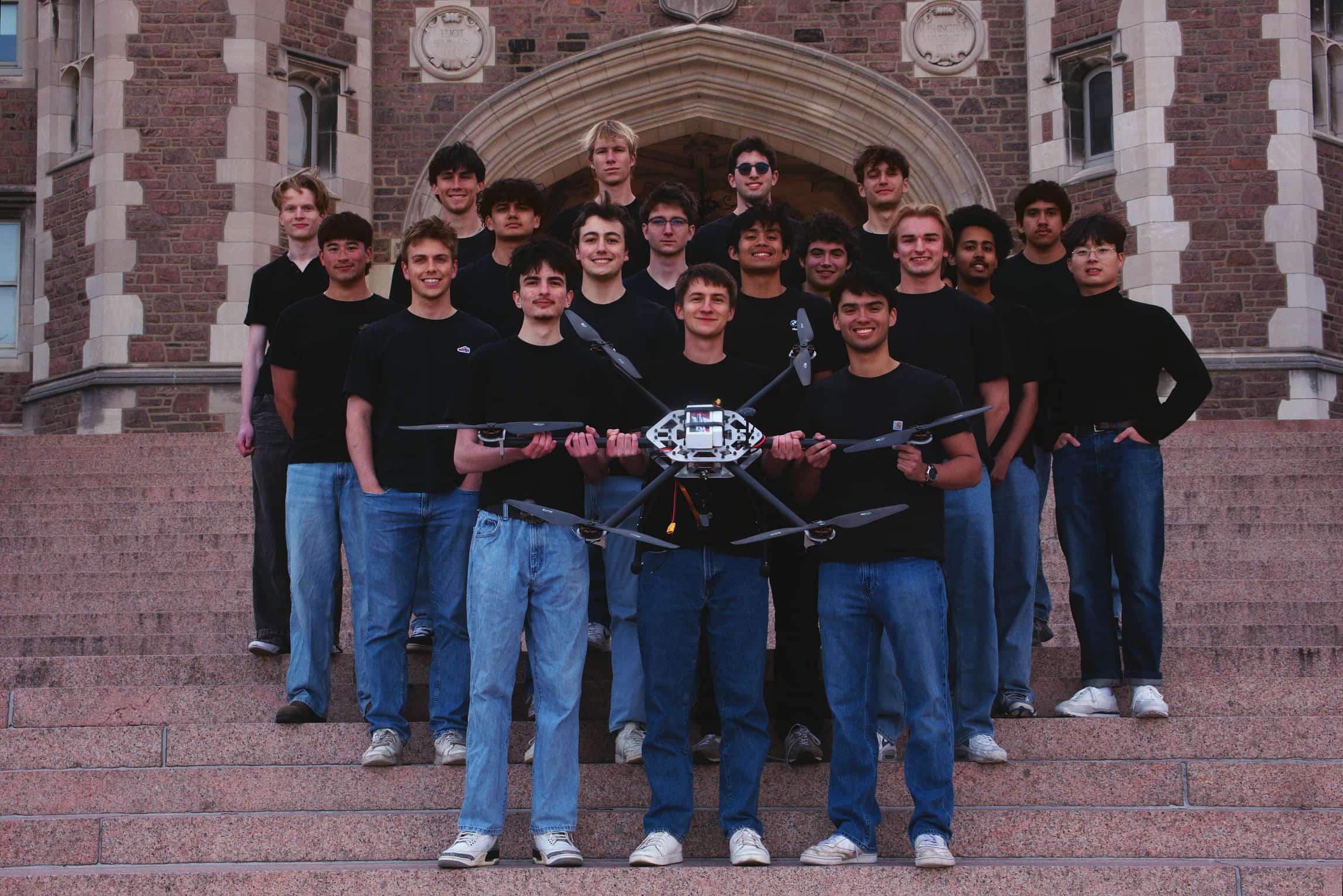 WashU VTOL student aerospace team standing with an aircraft prototype